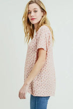 Cotton Bleu label printed V-neck short sleeve T-shirt in light pink with blue jeans