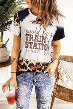 Womens short-sleeve tie-dye t-shirt with leopard jeans for a train station kinda day