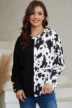 Cow print round neck long sleeve top with button cuffs