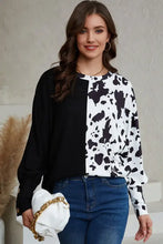 Cow print round neck long sleeve top with button cuffs