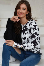 Black and white cow print round neck long sleeve blouse with bell sleeves
