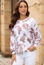 Women’s cow spots print drop shoulder puff sleeve sweatshirt in white and pink