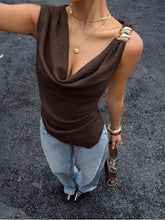 Brown cowl neck cami top featuring a deep neckline, one-shoulder drape, and soft flowing fabric for elegant wear