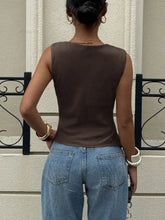 Brown sleeveless cowl neck cami top with fitted silhouette and subtle texture for elegant layering