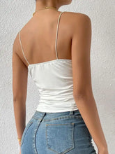 White satin cowl neck cami top with thin spaghetti straps and ruched fitted bodice for elegant wear