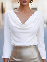 White cowl neck long sleeve blouse made of smooth flowing fabric with a stylish and elegant design