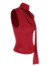A vibrant red cowl neck ruched sleeveless cami with a high collar and draped side tie detail