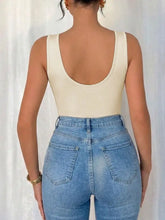 Cream-colored cowl neck sleeveless bodysuit showing the back with rounded neckline and thin shoulder straps