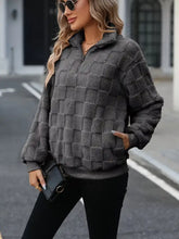 Cozy checkered fleece quarter zip sweatshirt in gray with a quilted textured design for warmth and comfort