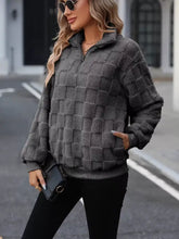 Cozy checkered fleece quarter zip sweatshirt in dark gray with quilted texture and half-zip collar design