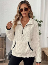 Cream-colored cozy sherpa half zip sweatshirt with textured knit fleece, black zipper, and relaxed fit trim