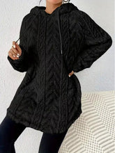 Black cozy textured drawstring fleece hoodie with knit fabric slightly stretchy and machine wash care instructions