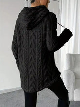 Black cable-knit hooded coat with plush textured fleece interior lining, slightly stretchy and machine wash care instructions
