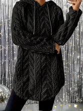 Black textured knit hoodie with hood and drawstrings made of slightly stretchy fleece for cozy wear machine wash care instructions included