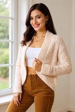 Cream boucle cropped cardigan with bell sleeve length and textured knit