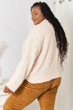 Cream boucle cropped cardigan with bell sleeve length, paired with mustard corduroy pants