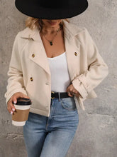 Cream double-breasted jacket with collared neck long sleeve and gold buttons