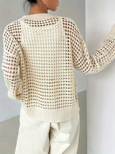 Cream knit button cardigan with heart features cutout and textured pattern