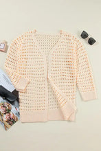 Peach openwork open front cardigan with slightly stretchy knit texture