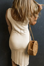 Cream knit midi dress with slightly stretchy fabric and woven handbag
