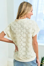 Cream short-sleeve top with 3D mesh flower fabric and drop shoulder