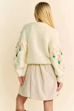 Cream floral embroidered cardigan with Dani floral pattern and button closure