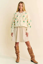 Cream embroidered cardigan with Dani floral pattern and button front