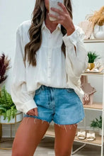 White button-up blouse with crinkled texture and lantern sleeve button long sleeves in subtle fabric