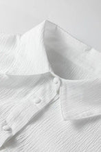 White crinkled texture cotton blouse with classic collar and matching buttons featuring lantern sleeve button design