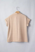Beige crochet lace accent pullover rolled short sleeve blouse showing back with subtle vertical seam and contrasting trim