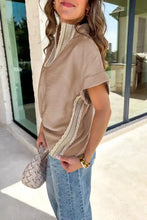 Beige crochet lace accent pullover rolled short sleeve blouse with lace trim along neckline and side seam