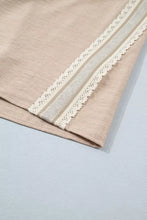 Beige linen pullover rolled short sleeve blouse with delicate white crochet lace trim along the edge