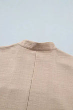 Beige linen jacket with subtle textured weave and clean back seam paired with crochet lace accent pullover rolled short sleeve blouse