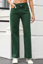 Dark green high-waisted denim crossed waist raw hem shift jeans with straight-leg cut and frayed hems