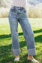 Light-wash denim cuffed straight loose jeans with rolled cuffs, striped inner lining, and subtle distressing