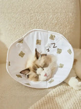 White fabric protective pet cone with beige bear and zzz patterns