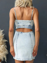 Light-wash denim cami dress two-piece set with cropped top, thin straps, and fitted high-waisted mini skirt