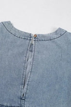 Light blue denim dress with cutout round neck balloon sleeves and back button closure in denim fabric