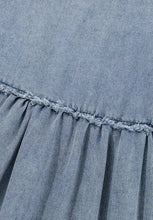 Denim dress with cutout round neck featuring a denim skirt with frayed hem and subtle stitching detail