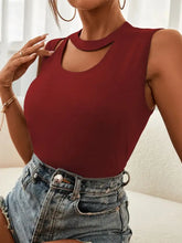 A fitted maroon cutout sleeveless tank top with a high neckline and shoulder cutout details