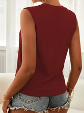 A sleeveless maroon cutout sleeveless tank top with a simple fitted design perfect for casual wear