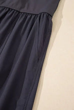 Charcoal gray cotton cutout square neck jumpsuit with pleated skirt