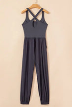 Cutout square neck active jumpsuit in charcoal gray with crisscross back