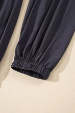 Cutout square neck jumpsuit with dark blue elastic waistband pants