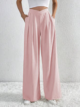 Soft pink v-waisted ruched front wide leg pants featuring pleated high waist wide leg trousers
