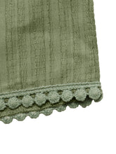 Olive green ribbed wide leg drawstring waist pants with scalloped edge and soft fluffy pom-pom trim detail