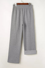 Gray heathered drawstring loose fit pants with elastic waistband and rolled cuffs for comfortable casual wear