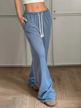 Light blue soft cotton drawstring wide leg pants with adjustable drawstring waist and relaxed flared silhouette