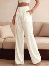 White high-waisted wide-leg pants with a satin finish and scalloped lace waist trim for elegant wear