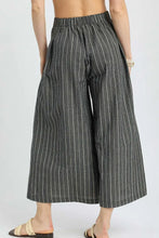 Umgee pinstripe crop palazzo pants in dark gray and white vertical stripes with textured fabric and elastic waistband cropped ankle length